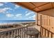 Inviting balcony with seating offers stunning views of the ocean and beach at 1305 S Ocean Blvd. # 204, North Myrtle Beach, SC 29582