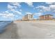 Expansive sandy beach with resort buildings, perfect for leisurely walks and ocean views at 1305 S Ocean Blvd. # 204, North Myrtle Beach, SC 29582