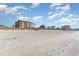 A wide sandy beach with condos and homes with easy access to the ocean at 1305 S Ocean Blvd. # 204, North Myrtle Beach, SC 29582