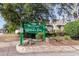 Community sign for 'Retreat at Glenn's Bay' amidst lush greenery and trees at 1356 Glenns Bay Rd. # 204D, Surfside Beach, SC 29575