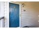 A front door with glass and gold hardware. The door is numbered 204 and has an outdoor light at 1356 Glenns Bay Rd. # 204D, Surfside Beach, SC 29575