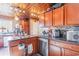 This kitchen features stainless steel appliances, granite countertops, and custom cabinets at 1356 Glenns Bay Rd. # 204D, Surfside Beach, SC 29575