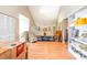 Living room with hardwood floors, display shelving, and a glass railing at 1356 Glenns Bay Rd. # 204D, Surfside Beach, SC 29575