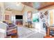 This open living room features a fireplace, TV, unique ceiling, hardwood floors and built in bar at 1356 Glenns Bay Rd. # 204D, Surfside Beach, SC 29575