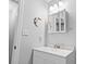 This bathroom features a white vanity with a mirrored medicine cabinet at 1409 Highway 15 # 4, Myrtle Beach, SC 29577