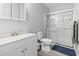 A bathroom showcasing a white vanity, toilet, and shower stall with glass door at 1409 Highway 15 # 4, Myrtle Beach, SC 29577