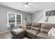 Charming living room with a gray sectional sofa and window views at 1409 Highway 15 # 4, Myrtle Beach, SC 29577