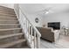 Inviting living room with a gray sofa, ceiling fan, and nearby staircase at 1409 Highway 15 # 4, Myrtle Beach, SC 29577