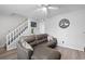 Comfortable living room featuring a large gray sofa and nearby staircase at 1409 Highway 15 # 4, Myrtle Beach, SC 29577