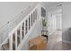 Well-lit staircase with carpeted steps and a wooden bench at 1409 Highway 15 # 4, Myrtle Beach, SC 29577