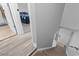 View of the carpeted stairs and flooring leading to a bedroom with a blue comforter at 1409 Highway 15 # 4, Myrtle Beach, SC 29577