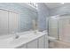 Bright bathroom features a double sink vanity and a glass-enclosed shower at 1529 Lanterns Rest Dr. # 201, Myrtle Beach, SC 29579