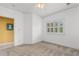 Carpeted bedroom with view to hall and window with bright natural light at 1529 Lanterns Rest Dr. # 201, Myrtle Beach, SC 29579
