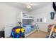 Bedroom with bunkbeds, neutral walls, and natural light from the window at 1529 Lanterns Rest Dr. # 201, Myrtle Beach, SC 29579