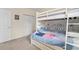 bedroom featuring carpet flooring, white walls, closet, and bunk bed at 1529 Lanterns Rest Dr. # 201, Myrtle Beach, SC 29579