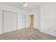 Neutral bedroom featuring carpet flooring, bright white walls, and standard sized closet with doors at 1529 Lanterns Rest Dr. # 201, Myrtle Beach, SC 29579