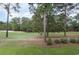 Scenic view of the golf course surrounded by tall pine trees and lush greenery at 1529 Lanterns Rest Dr. # 201, Myrtle Beach, SC 29579