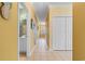 Hallway featuring tiled flooring, yellow walls, and access to other rooms at 1529 Lanterns Rest Dr. # 201, Myrtle Beach, SC 29579