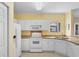 Bright kitchen with white cabinets, appliances, and granite countertops at 1529 Lanterns Rest Dr. # 201, Myrtle Beach, SC 29579