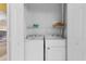 Laundry room featuring washer and dryer hookups with upper storage shelves at 1529 Lanterns Rest Dr. # 201, Myrtle Beach, SC 29579