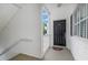 Cozy covered porch featuring a black front door, Giants welcome mat, and white railing at 1529 Lanterns Rest Dr. # 201, Myrtle Beach, SC 29579