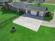 Aerial view of spacious backyard with patio area, firepit, and lush green lawn at 1586 Bridgebrook Ln., Conway, SC 29527