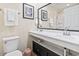 Bright bathroom features double sinks, a large mirror, and neutral wall color at 1586 Bridgebrook Ln., Conway, SC 29527