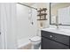 Bathroom featuring a modern vanity, tiled shower, and neutral décor at 1586 Bridgebrook Ln., Conway, SC 29527