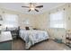 Bedroom with neutral decor, ceiling fan, carpet, and light-filled windows at 1586 Bridgebrook Ln., Conway, SC 29527