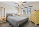 Cozy bedroom features neutral paint, a large window, ceiling fan, and carpeted floors at 1586 Bridgebrook Ln., Conway, SC 29527