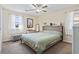 Comfortable bedroom with neutral color scheme, ceiling fan, and ample natural light at 1586 Bridgebrook Ln., Conway, SC 29527