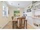 Dining room with tile floor, built-in shelving, and a farmhouse-style table at 1586 Bridgebrook Ln., Conway, SC 29527