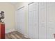 Hallway featuring multiple closets offering generous storage space and wood-look flooring at 1586 Bridgebrook Ln., Conway, SC 29527