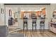 Kitchen bar featuring wood cabinets and granite countertop with barstool seating at 1586 Bridgebrook Ln., Conway, SC 29527