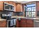 Cozy kitchen with stainless steel appliances, granite counters, and black backsplash at 1586 Bridgebrook Ln., Conway, SC 29527