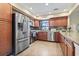 Well-equipped kitchen with stainless steel appliances, granite counters, and a view to the backyard at 1586 Bridgebrook Ln., Conway, SC 29527