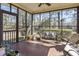 Sunroom featuring a ceiling fan, tile flooring, and views of the lush yard at 1586 Bridgebrook Ln., Conway, SC 29527