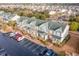 Aerial view of a community featuring manicured lawns, green roofs, and assigned parking at 159 Chenoa Dr. # E, Murrells Inlet, SC 29576