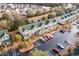 Aerial view of townhomes with lush landscaping and ample parking; a great neighborhood! at 159 Chenoa Dr. # E, Murrells Inlet, SC 29576