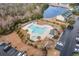 Aerial view of community pool area, featuring a hot tub, pool furniture and grilling area at 159 Chenoa Dr. # E, Murrells Inlet, SC 29576