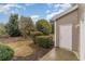 Backyard landscaping with a door to the home's exterior at 159 Chenoa Dr. # E, Murrells Inlet, SC 29576