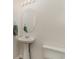 Powder room with pedestal sink and oval mirror at 159 Chenoa Dr. # E, Murrells Inlet, SC 29576