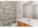 Bathroom featuring a floral shower curtain, vanity with mirror, and a toilet at 159 Chenoa Dr. # E, Murrells Inlet, SC 29576