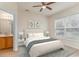 Cozy bedroom with neutral decor, complemented by soft lighting and an ensuite bath at 159 Chenoa Dr. # E, Murrells Inlet, SC 29576