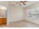 Spacious bedroom with ensuite bathroom and wood-look floors at 159 Chenoa Dr. # E, Murrells Inlet, SC 29576