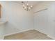 Dining area with wood-look floors and stylish chandelier at 159 Chenoa Dr. # E, Murrells Inlet, SC 29576