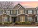 Charming brick townhome with lush landscaping and a welcoming entryway at 159 Chenoa Dr. # E, Murrells Inlet, SC 29576