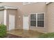 Home exterior with a patio and neutral siding with white trim at 159 Chenoa Dr. # E, Murrells Inlet, SC 29576