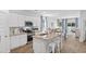 Bright kitchen with white cabinets, granite countertops, and seating at the island at 159 Hoffman Park Dr. # 79, Myrtle Beach, SC 29588