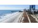 Wide beach and pier with city skyline in the distance at 1604 N Ocean Blvd. # 605, Myrtle Beach, SC 29577